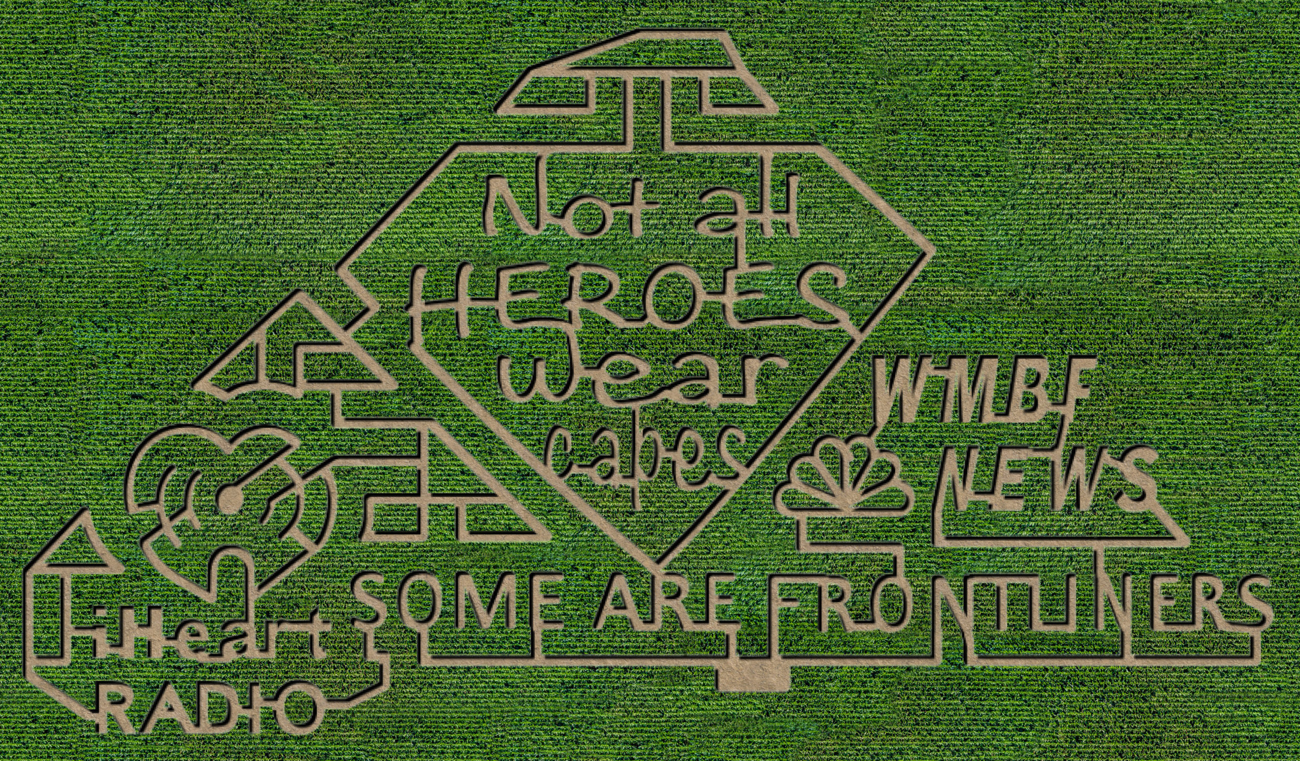 A corn maze with some kind of message written on it.